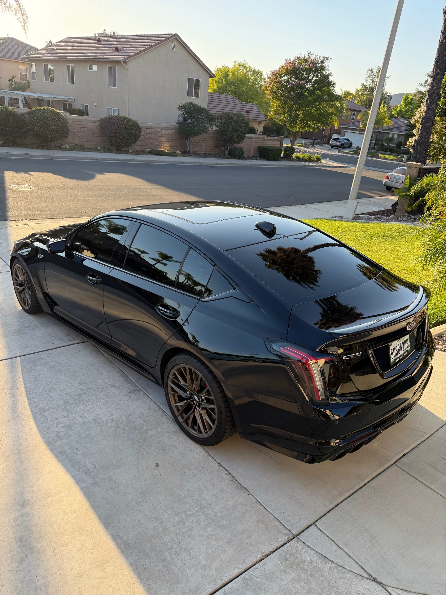 Black Cadillac CT5-V with premium window tint and paint protection film at JTINT in Murrieta, CA